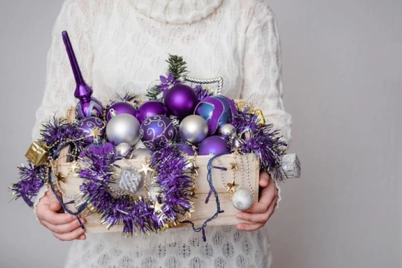 purple ornaments in box